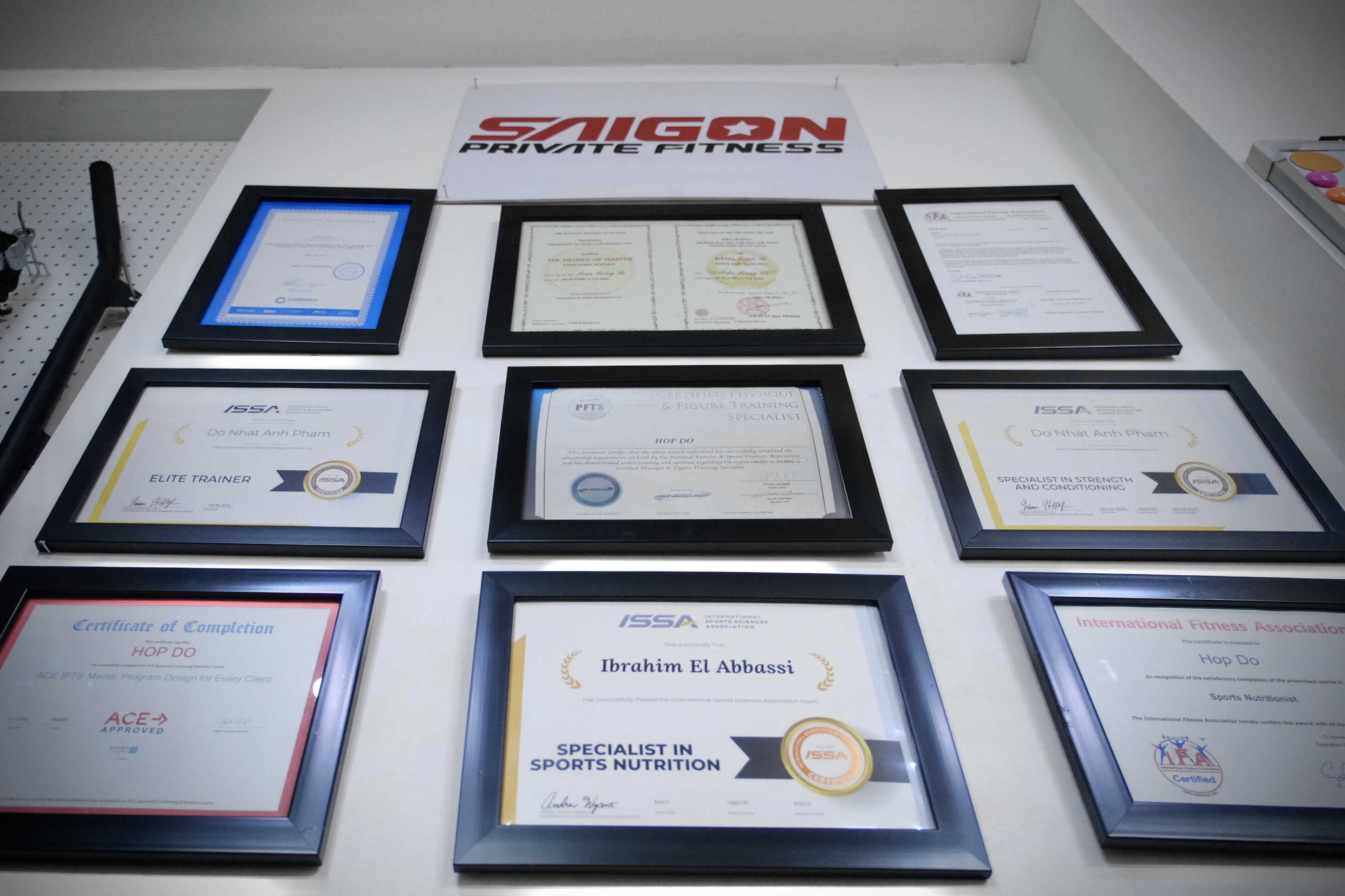 Trainer guiding a client through a lift