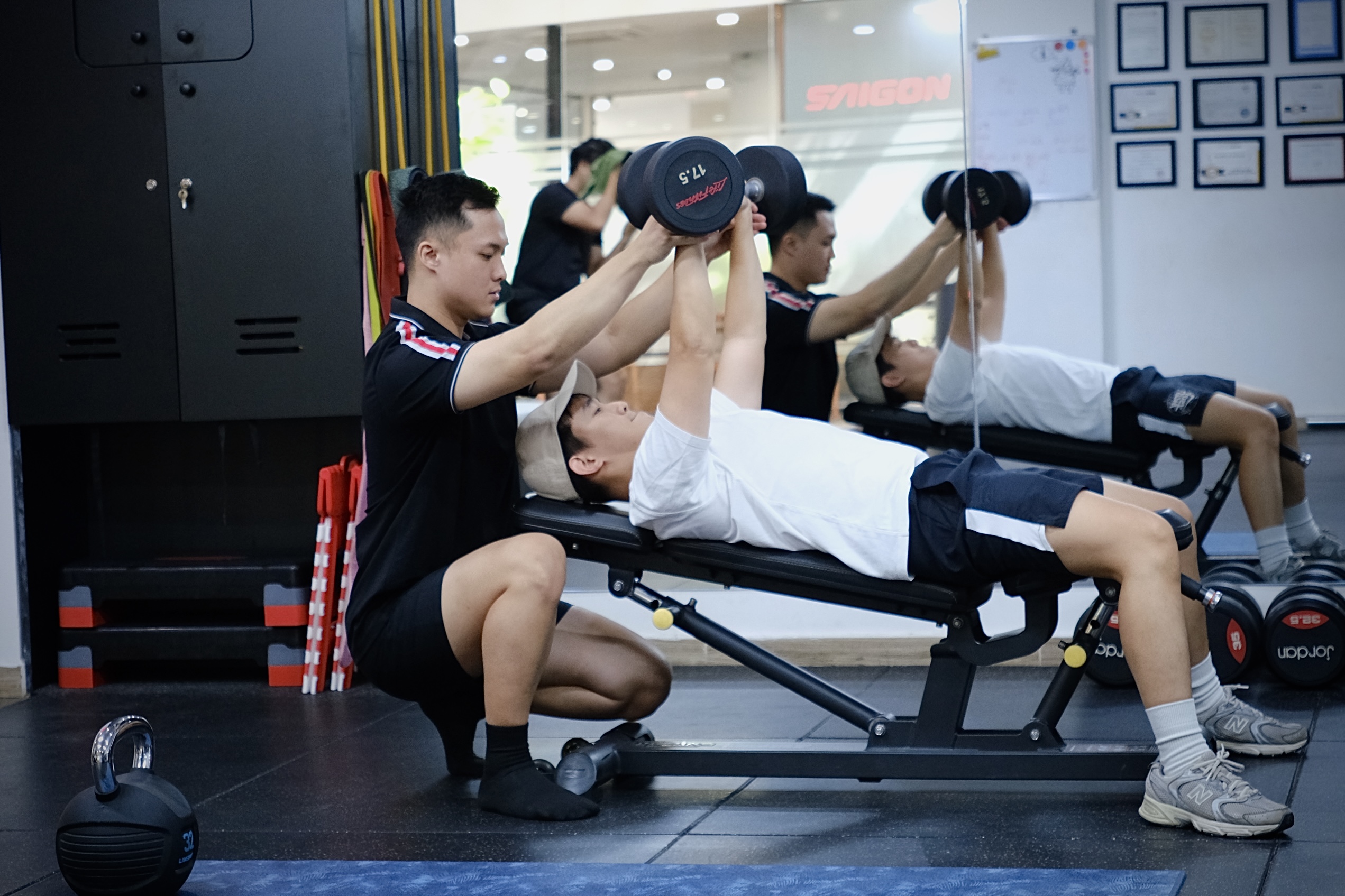 Row of weights and benches at Saigon Private Fitness